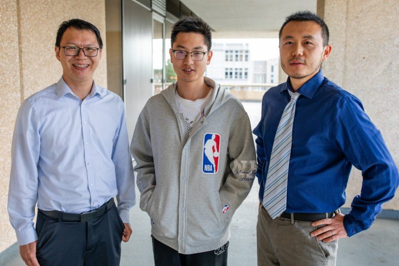 Ph.D. student scholarship recipient Runing Yang (at center) with faculty mentors Haibo Huang  (at left) and Ming Jin (at right).  
