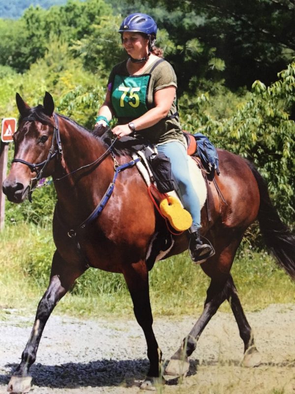 Jenny Jones riding a horse.