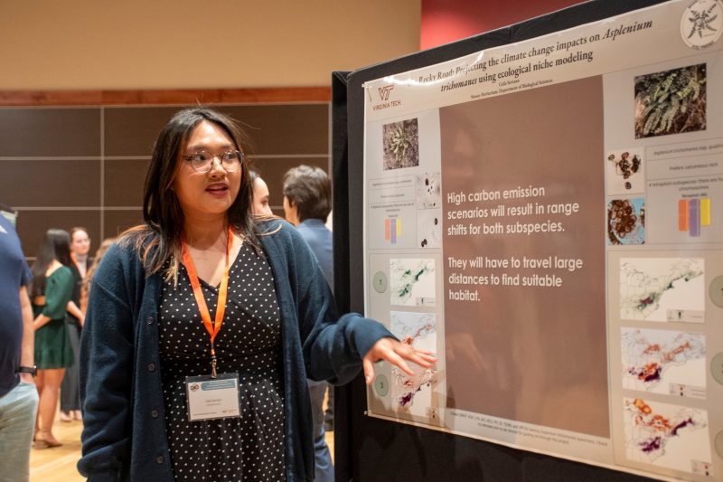 Caila Serrano '24 discusses her research at the Dennis Dean Undergraduate Research and Creative Scholarship Conference. Photo by Javeria Zulfqar for Virginia Tech.