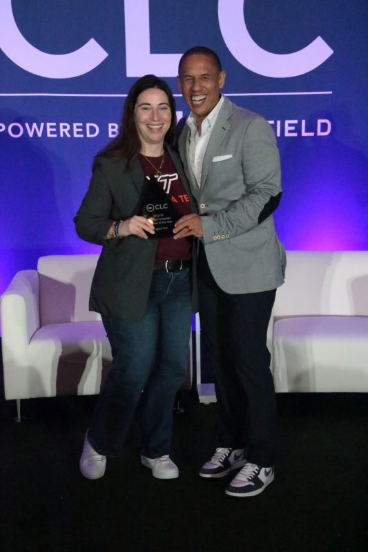 Virginia Tech's Renee Alarid (right) accepts the National Campaign Marketer of the Year award from the College Licensing Company. Photo courtesy of Tammy Purves, Learfield.