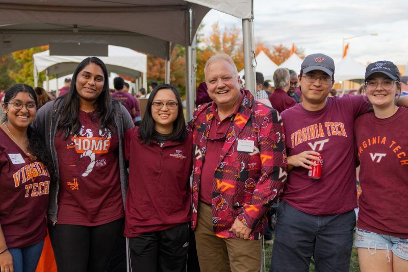 IEEE at VT Board members Shreya Balaji, Akshara Ravi, Jenny Li, Jack Orr and Haley Rindfleish stand at an ECE tailgate with Dr. Scott Dunning, their advisor.