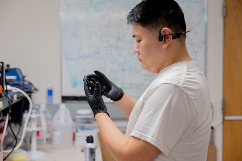 Chuan Xiao in the Multi-Modal Lab ECE graduate student Chuan Xiao works with biochips in the multi-modal lab.