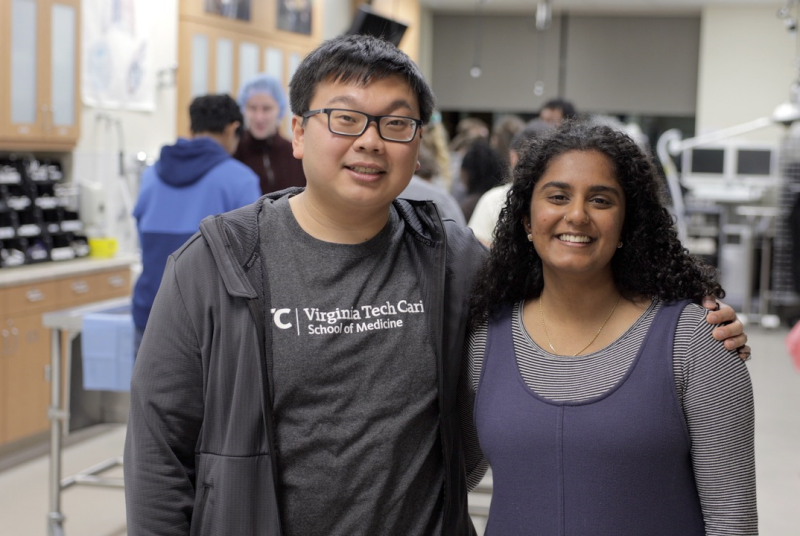 Roger Luong and Shruthi Prabhakar Man and woman standing side-by-side in a lab
