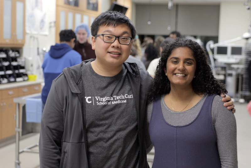 Man and woman standing side-by-side in a lab