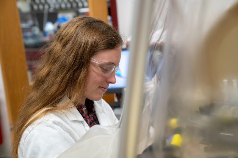 Woman in white labcoat in a lab.
