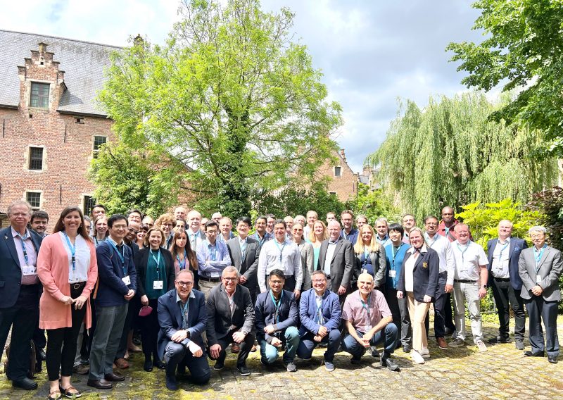 Group photos of 60 cybersecurity experts from 10 countries at the U.S./European Cybersecurity Workshop held in May 2024 in Belgium.
