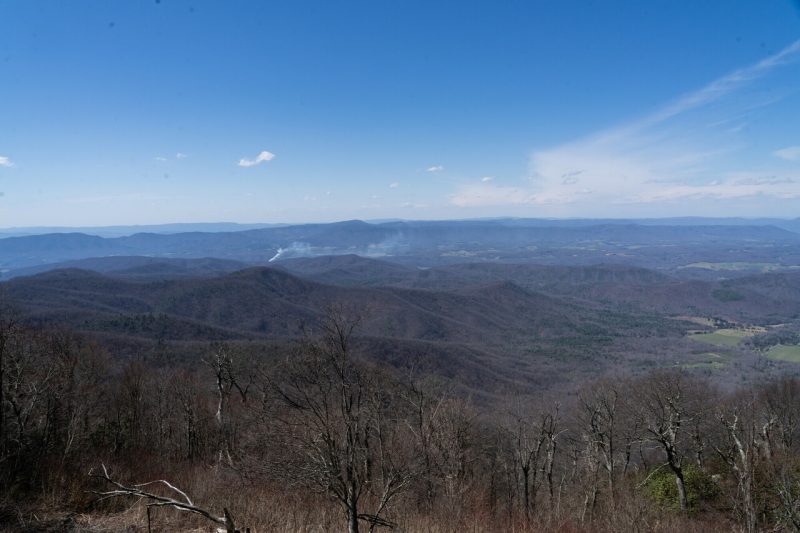 March 30, 2024. The view from the Blue Ridge Parkway near Apple Orchard Mountain with a brush fire in the valley below. (Photo by Clark Dehart for Virginia Tech)