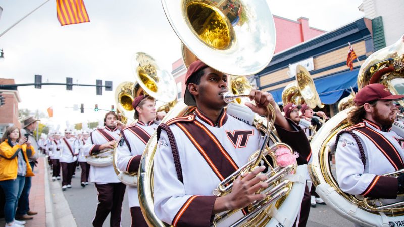 The Marching Virginians perform during a Homecoming parade through downtown Blacksburg. 