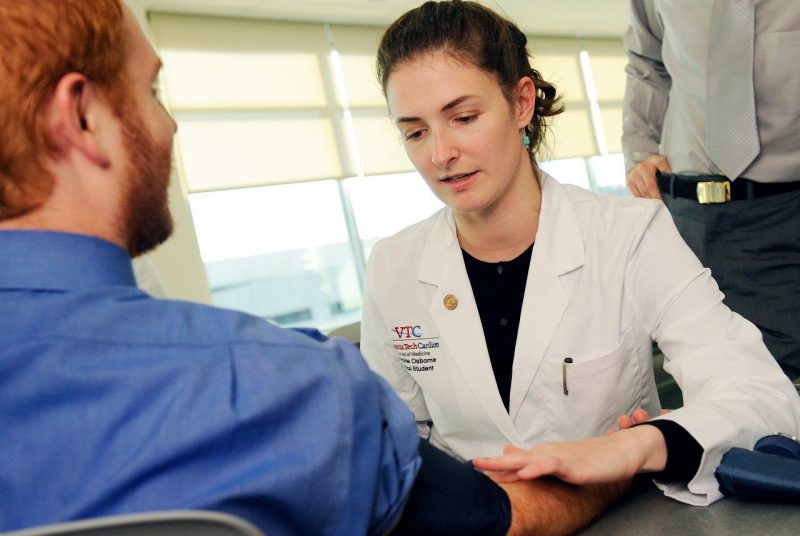 Caroline Osborne (at right) practiced her clinical skills with fellow charter class student James Light.