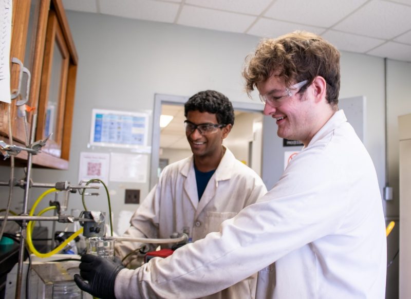 Two students working together in a lab.