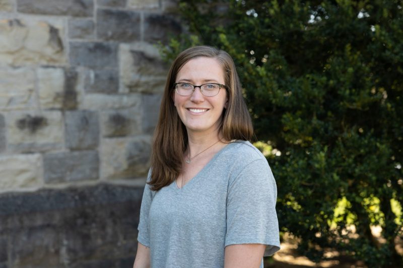 Corinne Guimont stands in front of Newman Library's Hokie Stone.