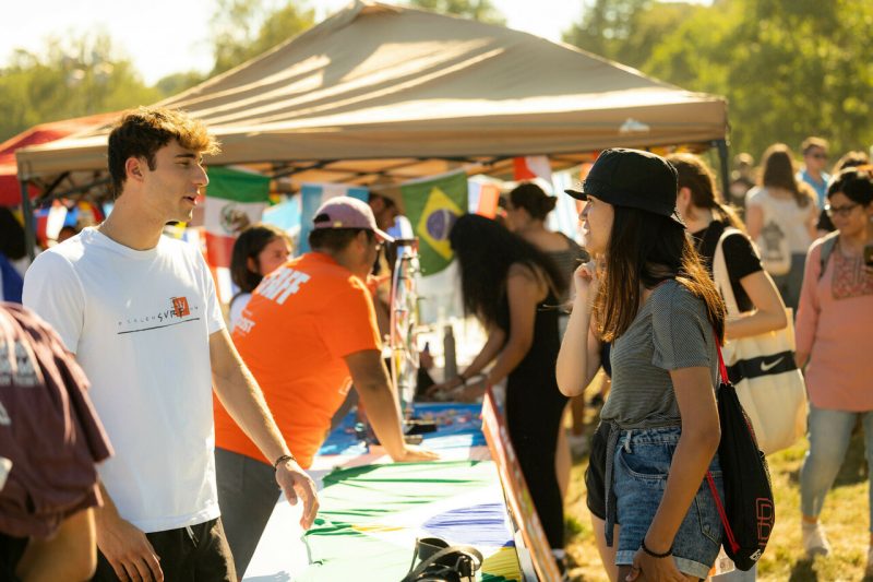 students talking at an interest table