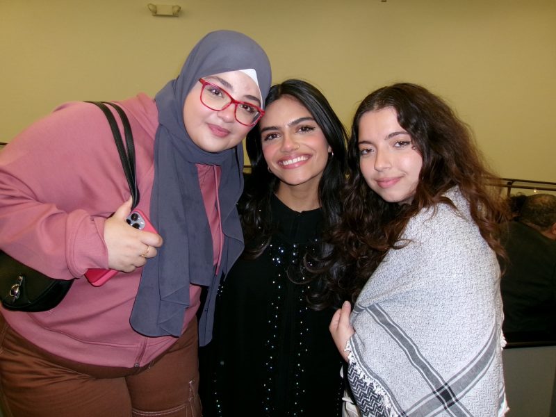 Rabihah with two friends posing for a picture