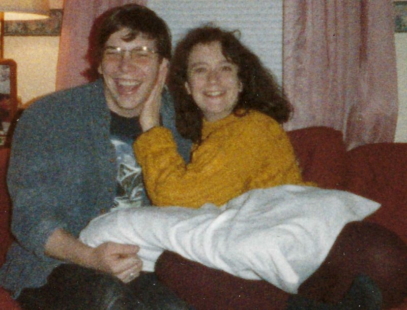 Julie and Todd sharing a fun moment together in a dormitory