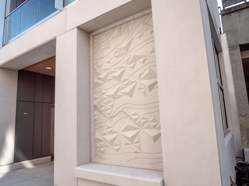 Detailed shot of the elevator bases which feature patterns precast in the concrete.