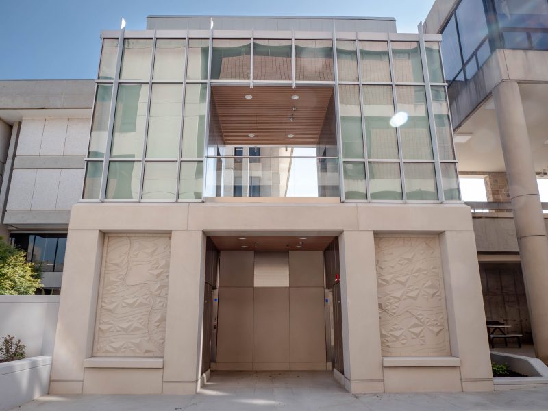 Two elevator doors are visible at the base of the elevator tower