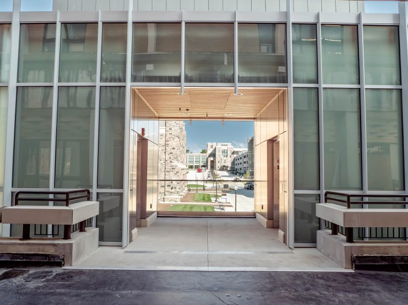 Looking between two elevators, the bus loops at the Transit Center are visible.