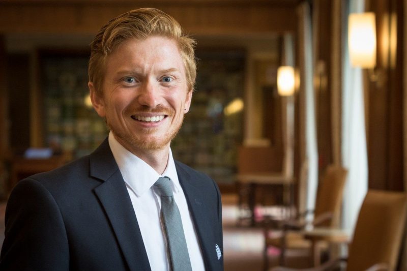 Headshot photo of male in a business suit