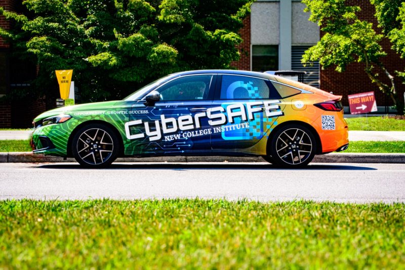 A brightly colored car with a giant CyberSAFE label.