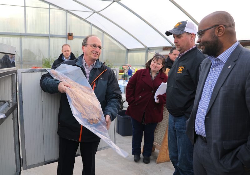 T. David Reed, a tobacco agronomist, discusses tobacco curing with visitors to the Southern Piedmont AREC.