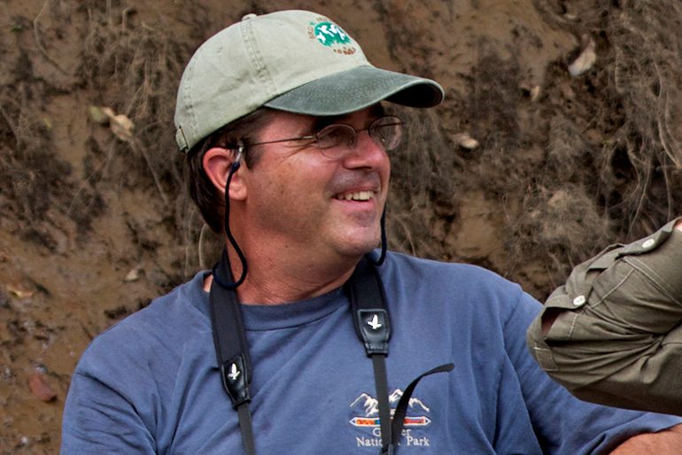 close up of person with camera around his neck