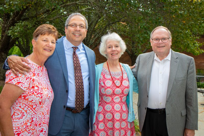 Susan E. Short, Guru Ghosh, Jane Swan, and John Dooley posing for a picture