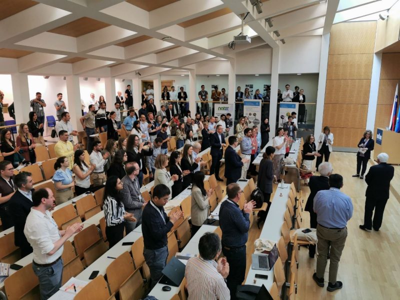 A group of colleagues giving a standing ovation.