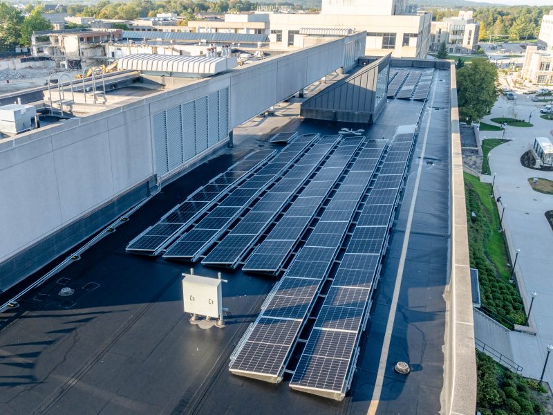Rows of solar arrays are installed on the roof of Durham Hall