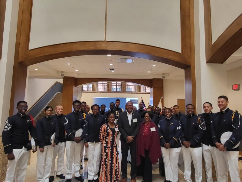 The Cherry family poses with Cadets following a ceremony honoring the donation of the saber and ring of Lindsay Cherry '58. The Cherry family stands in the middle of a group of current cadets at Virginia Tech.