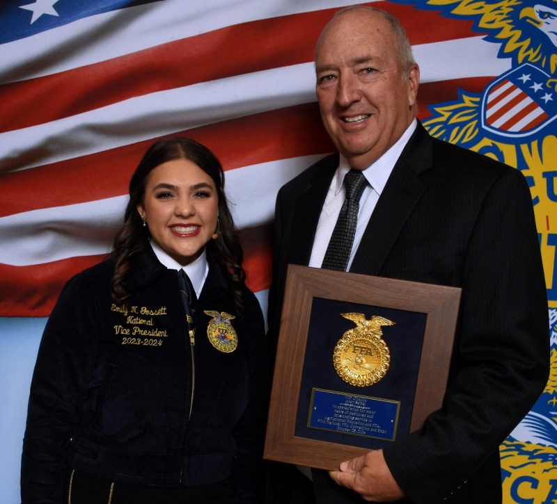 Emily Gossett, FFA vice president, with Andy Seibel and his award
