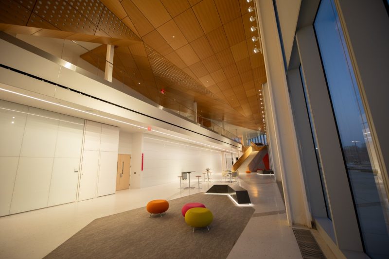 a large open room with two levels and brightly colored furniture