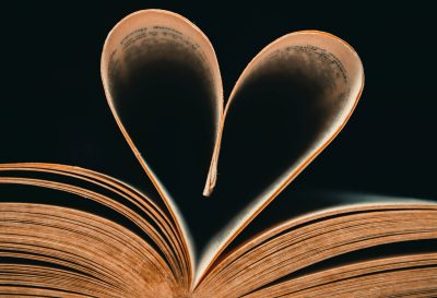 The leaves of a book arranged in the shape of a heart. Photo courtesy Pexels