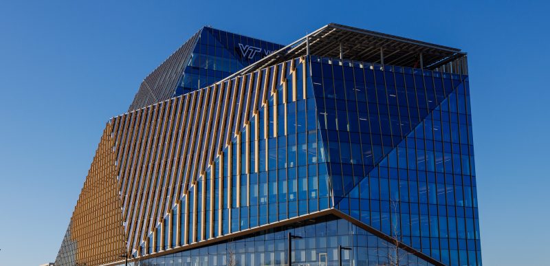 glass building reflecting the blue sky