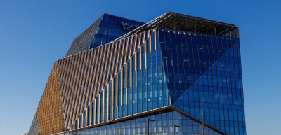 glass building reflecting the blue sky