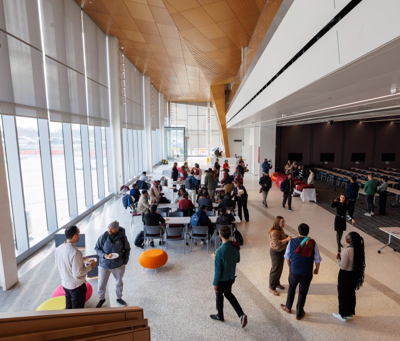 a crowd of people on the first floor of a building