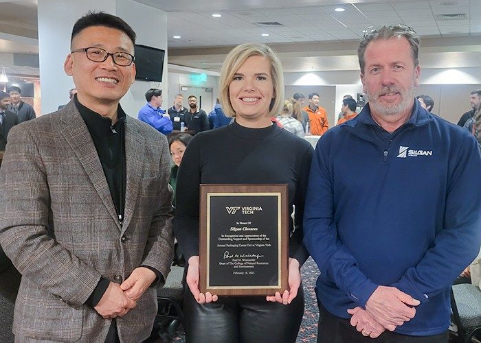 Silgan award Associate Professor Young Kim (left) stood with Silgan Closures reps Sylvia Tomal and Jerry Book with a plaque roof appreciation to Silgan Closures for ongoing support of the annual Packaging Career Fair. Photo courtesy of Young Kim.