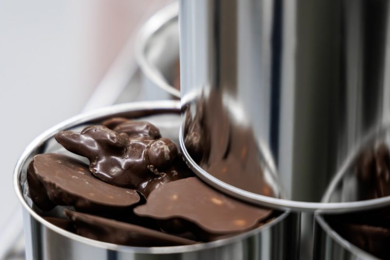 Chocolate candy in a metal container.