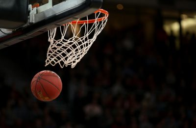 A basketball swishing through a hoop