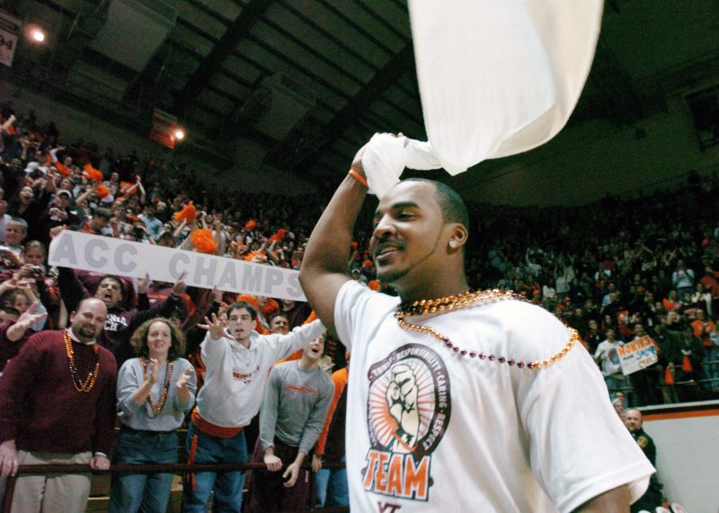 Bryan Randall celebrating at a pep rally following a win at Miami