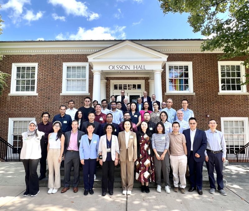 Group of 50 Virginia researchers standing in front of a building at the University of Virginia. 