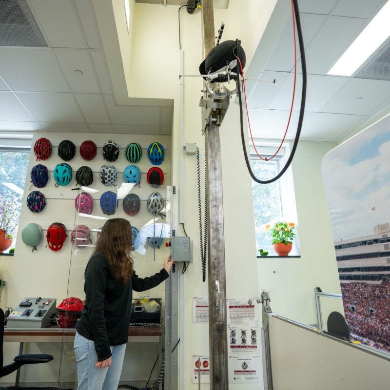 Lauren Duma prepares equestrian helmet for testing.