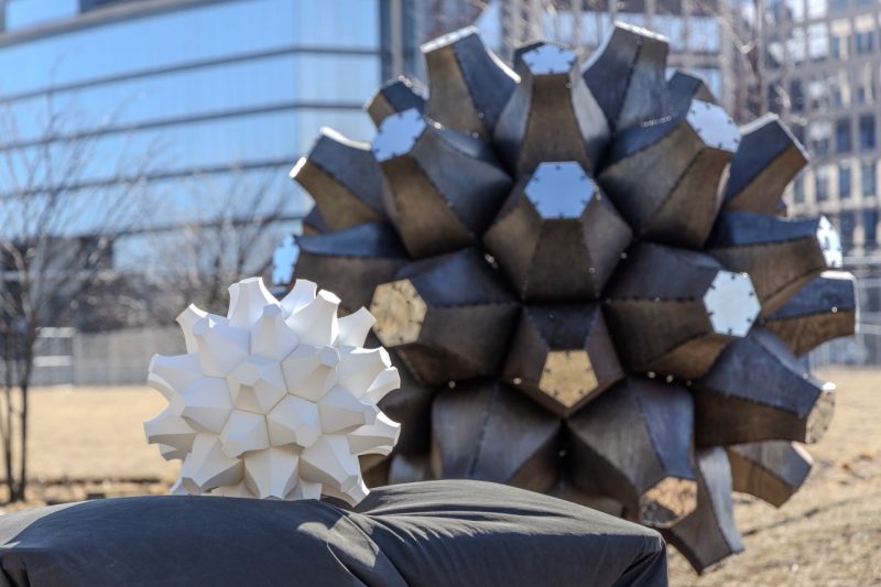 A scale model of Emergence sits in the foreground following installation of the full-scale sculpture. Photo by Damon Brewer for Virginia Tech.