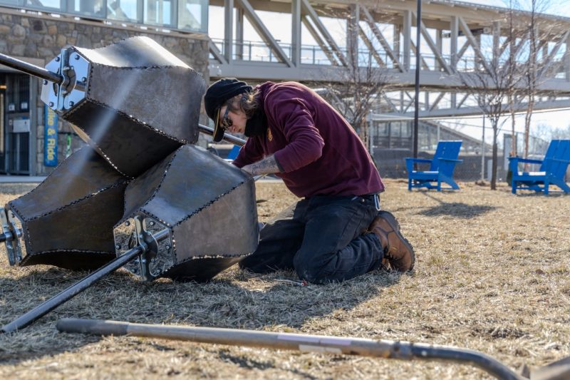 Braden Perryman screws internal joints during assembly of Emergence. Photo by Trevor Finney for Virginia Tech.