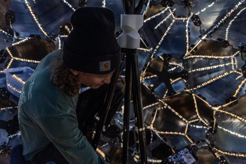 Braden Perryman adjusts internal components inside Emergence. Photo by Damon Brewer for Virginia Tech.