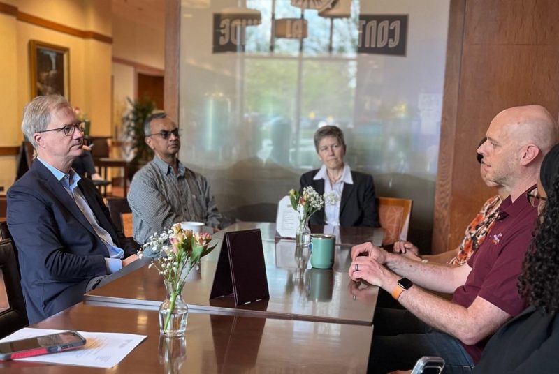 people talking at a table