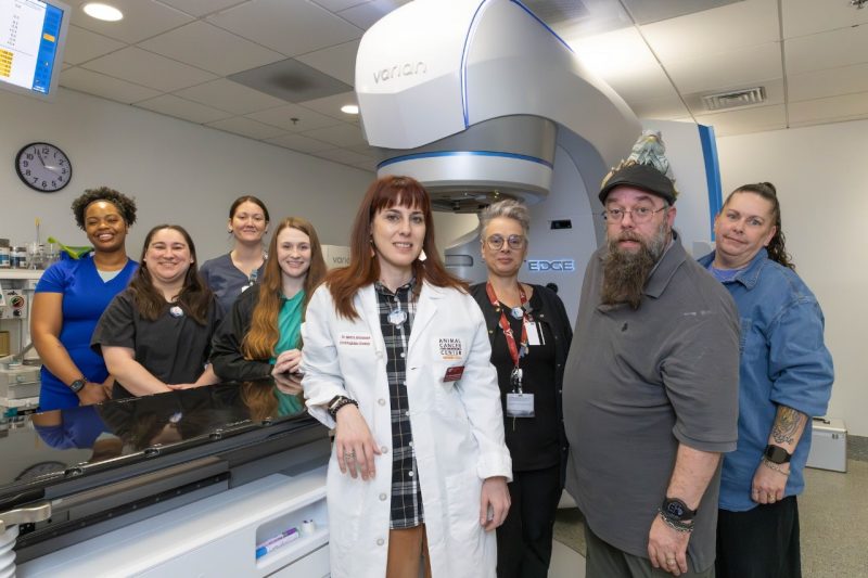 Echo the Iguana A group photo of the LVTs and Dr. Ilektra Athanasiadi (at left and center) that helped Echo during his treatment at the Animal Cancer Care and Research Center with Tom and Melissa Smith (at right)