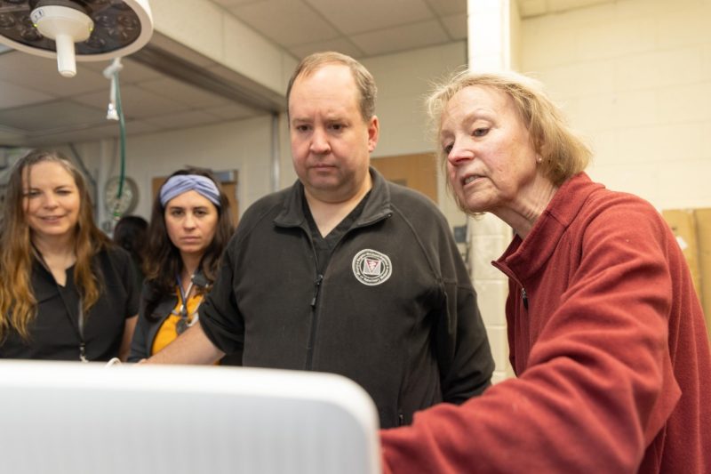 Ultrasound Demo Emeritus Professor Dr. Martha Larson demonstrating how to use the portable ultrasound machine to Community Practice doctors in the Veterinary Teaching Hospital