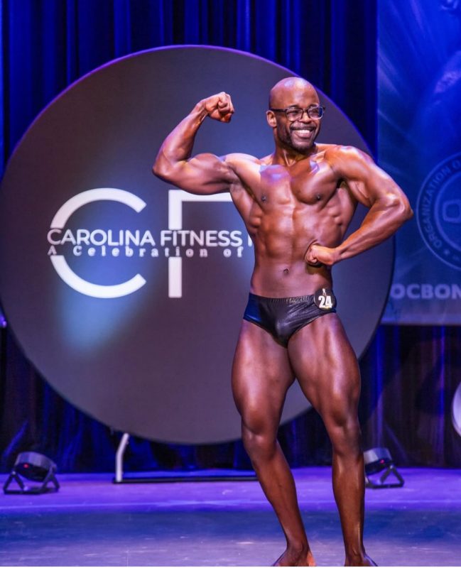 Greg Echols posing in a body building competition at the Carolina Fitness Festival