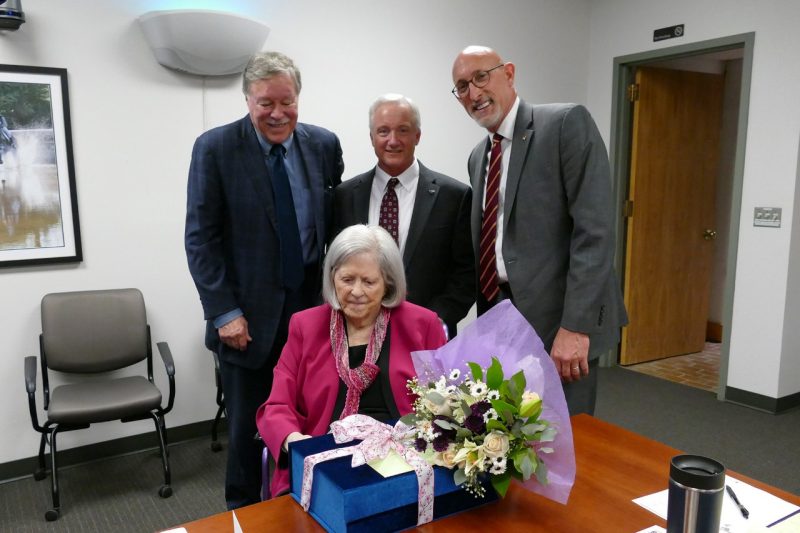 Shelley Duke Shelley Duke receiving flowers and gifts in a board room.
