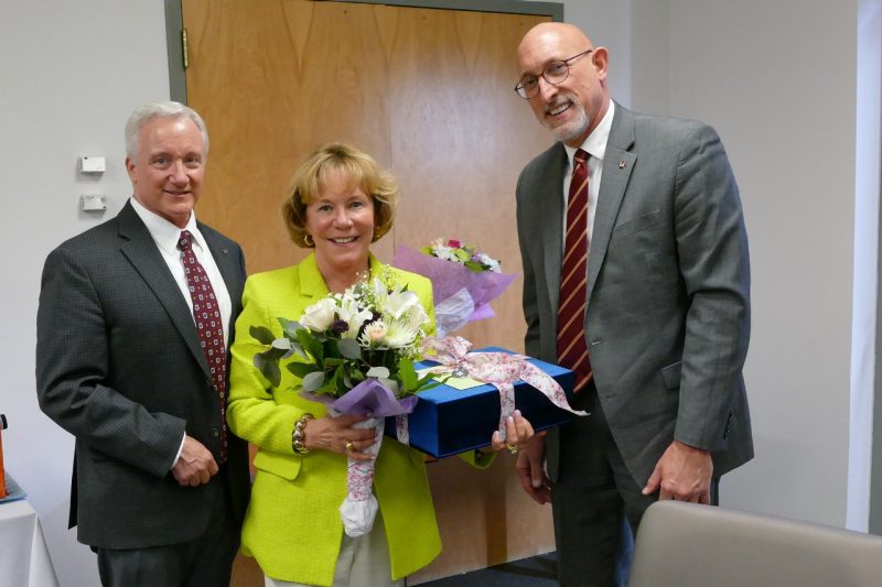 Cindy Ingram Cindy Ingram receiving flowers and gifts in a board room.